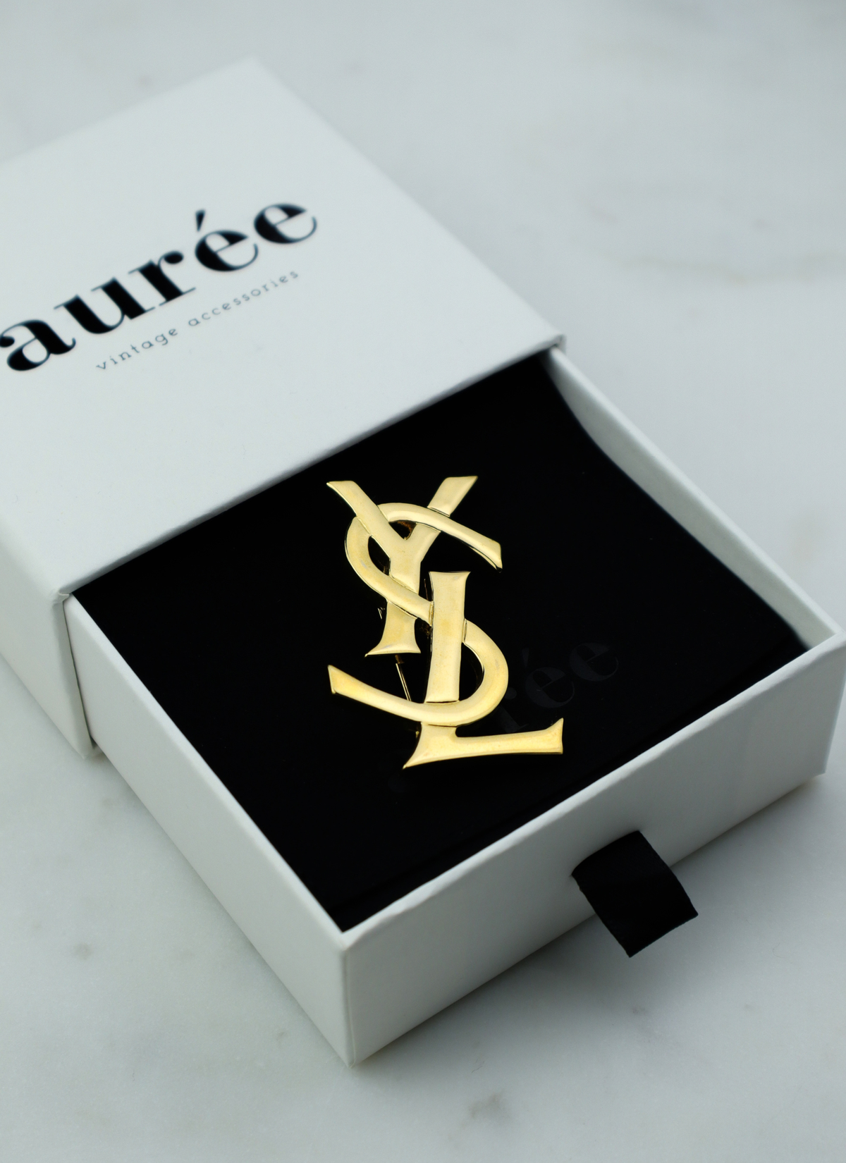 Yves Saint Laurent vintage broszka Cassandre