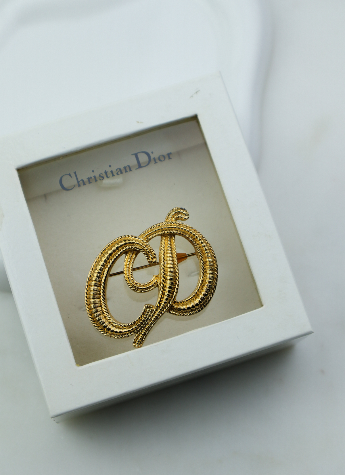 Christian Dior vintage broszka spleciony monogram CD