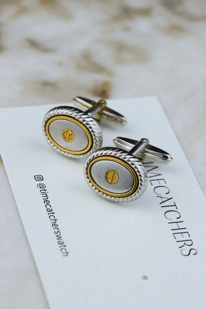 Dunhill – stalowo-złocone owalne spinki z logo (SP007)