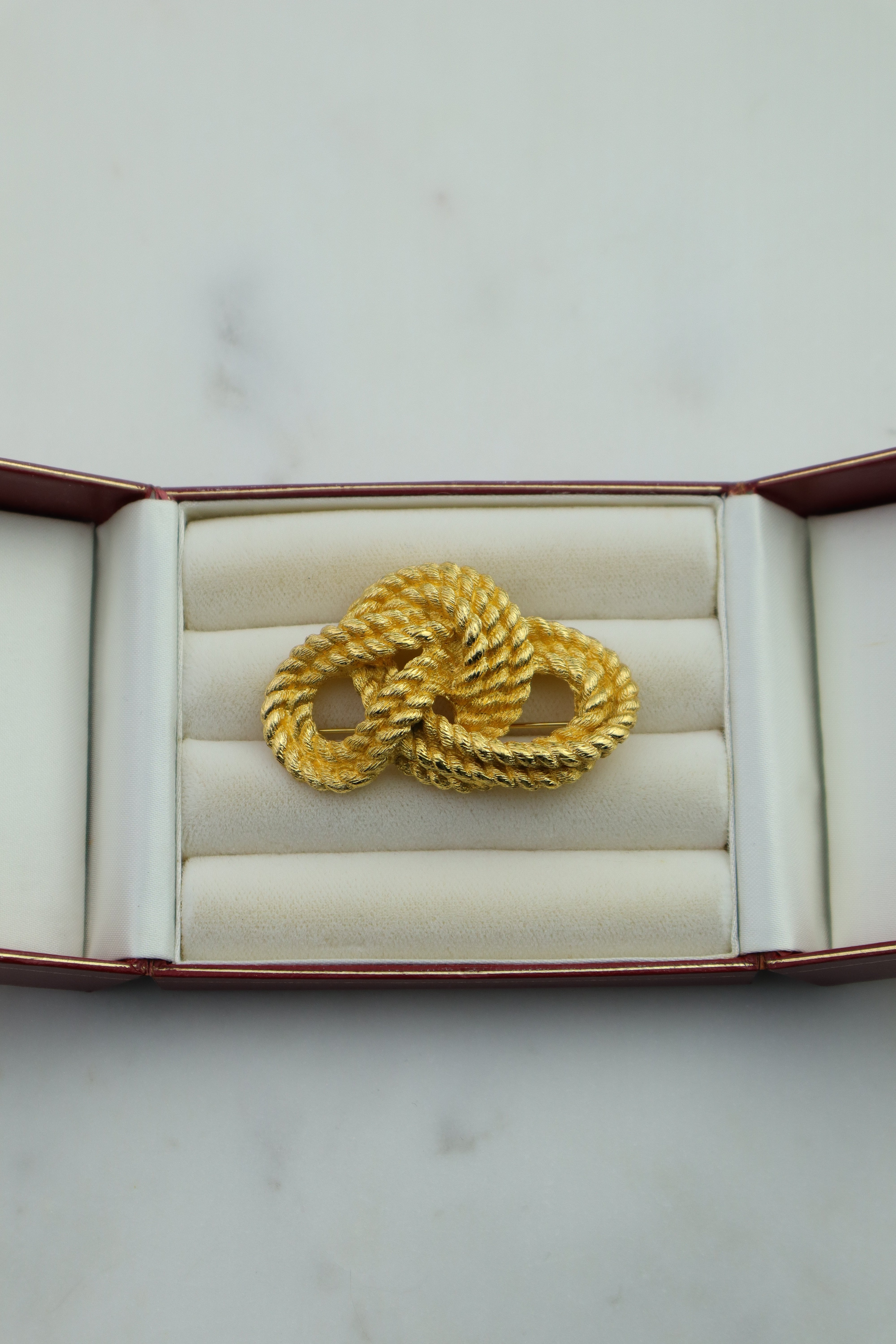 Christian Dior - pozłacana broszka "Knot"