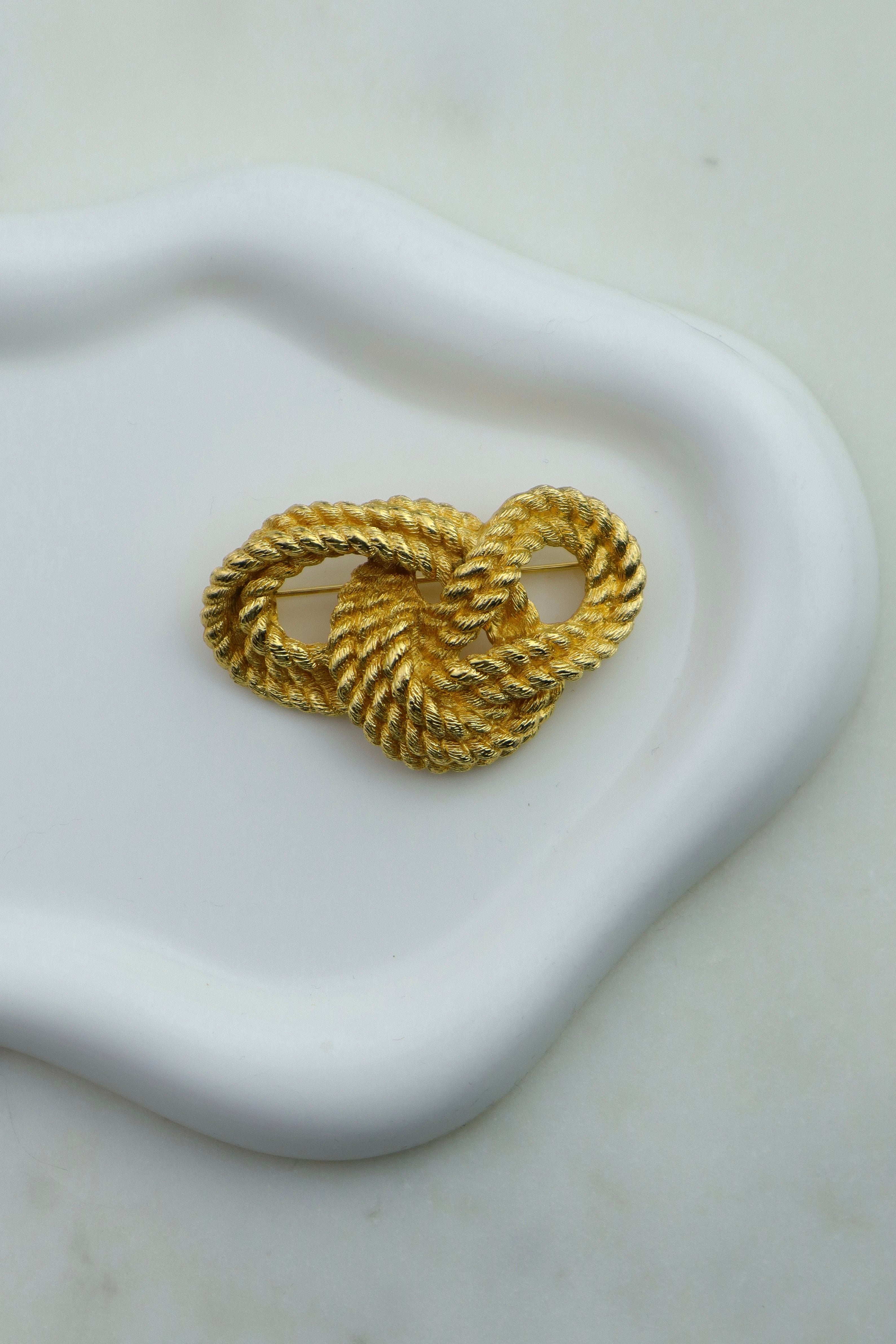 Christian Dior - pozłacana broszka "Knot"