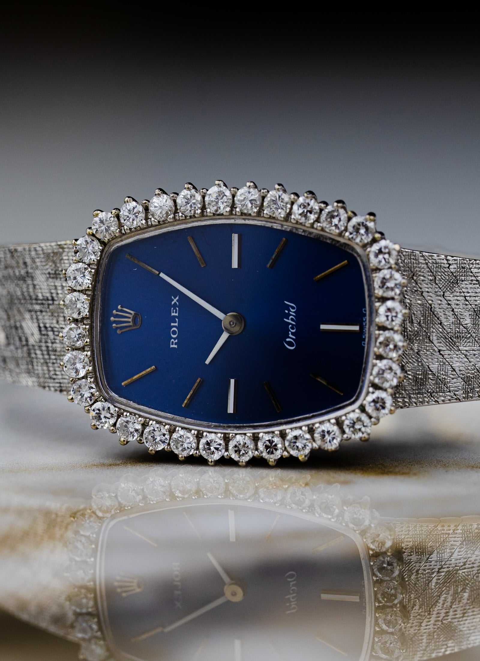 1975 18K Lady Rolex Orchid Navy Dial Diamond Bezel 2676