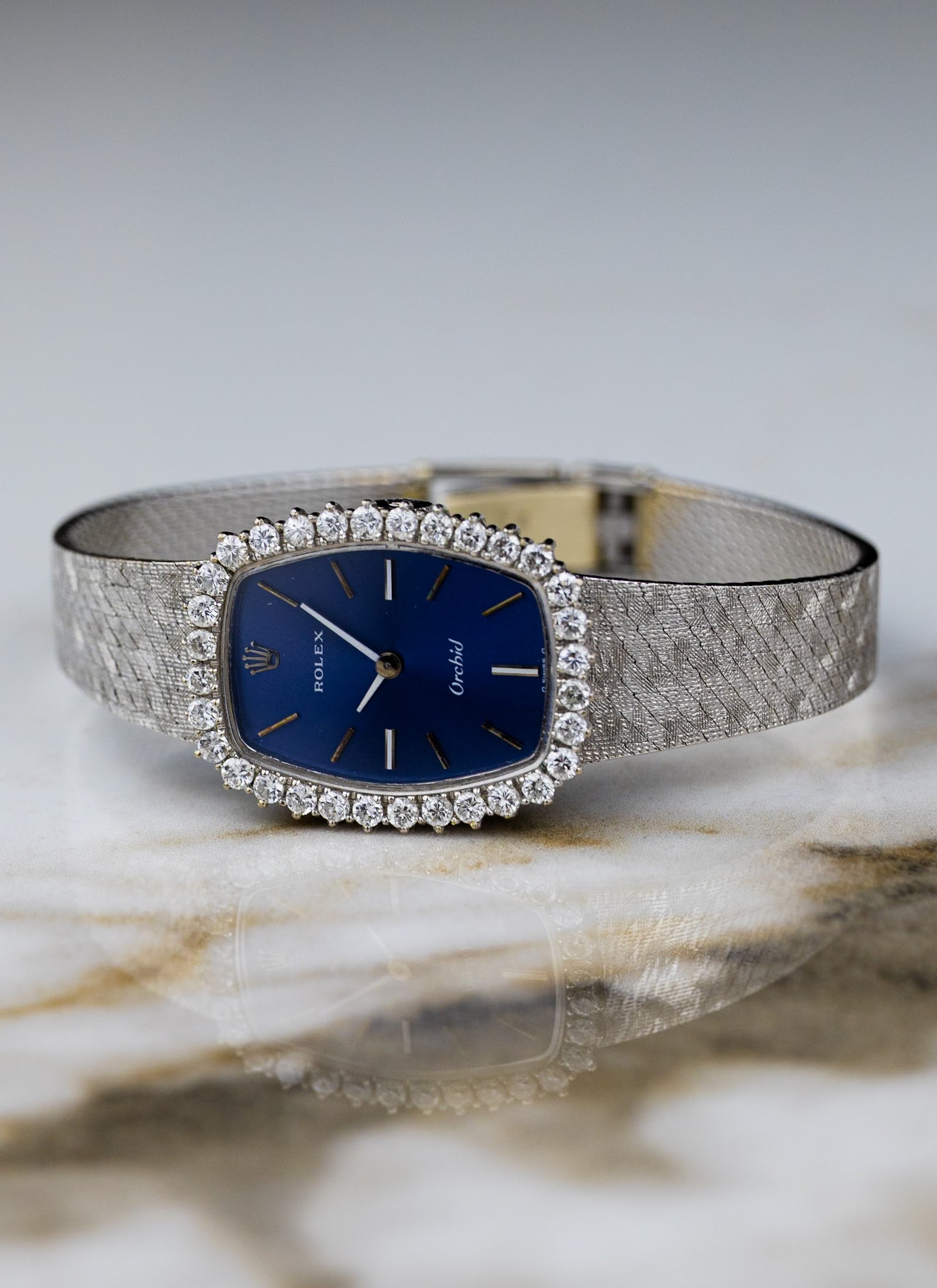 1975 18K Lady Rolex Orchid Navy Dial Diamond Bezel 2676