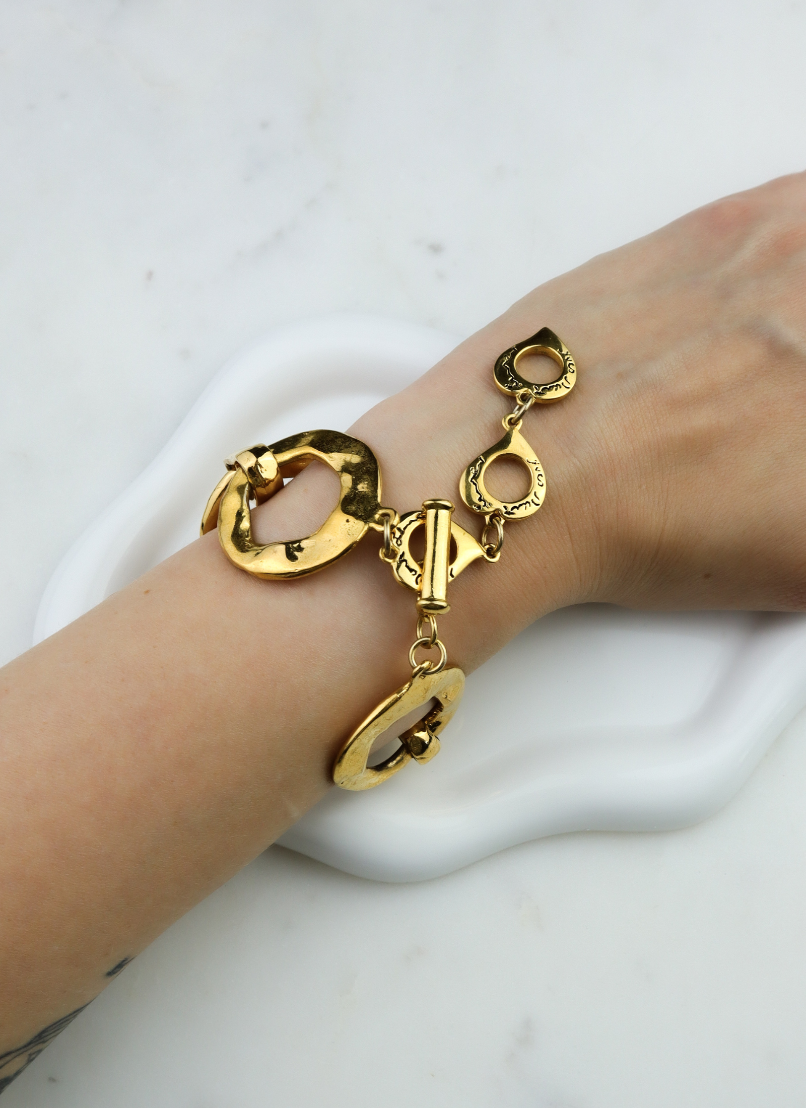 Yves Saint Laurent - bransoletka vintage z organicznych ogniw i kultowych serc