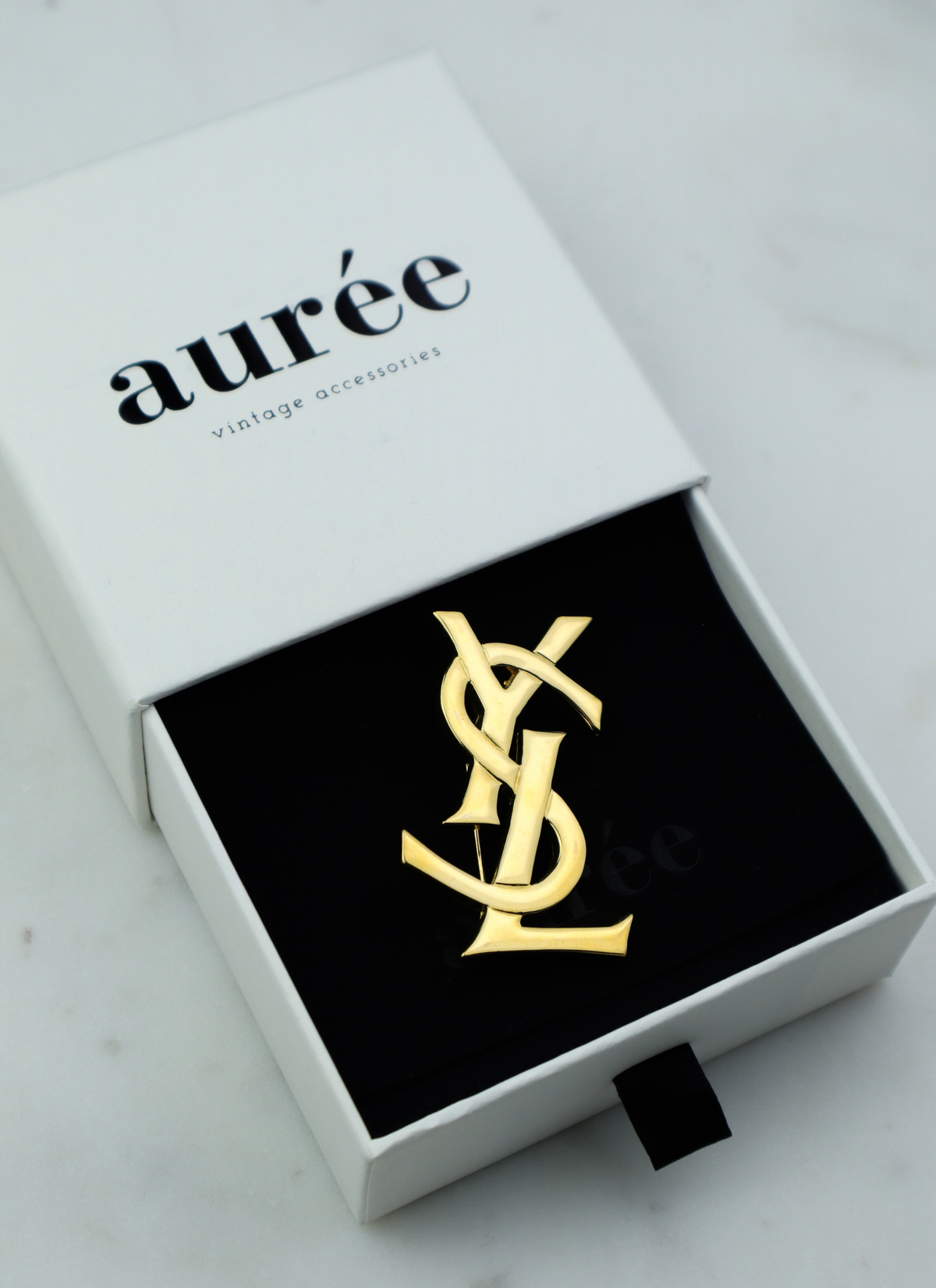 Yves Saint Laurent vintage broszka Cassandre