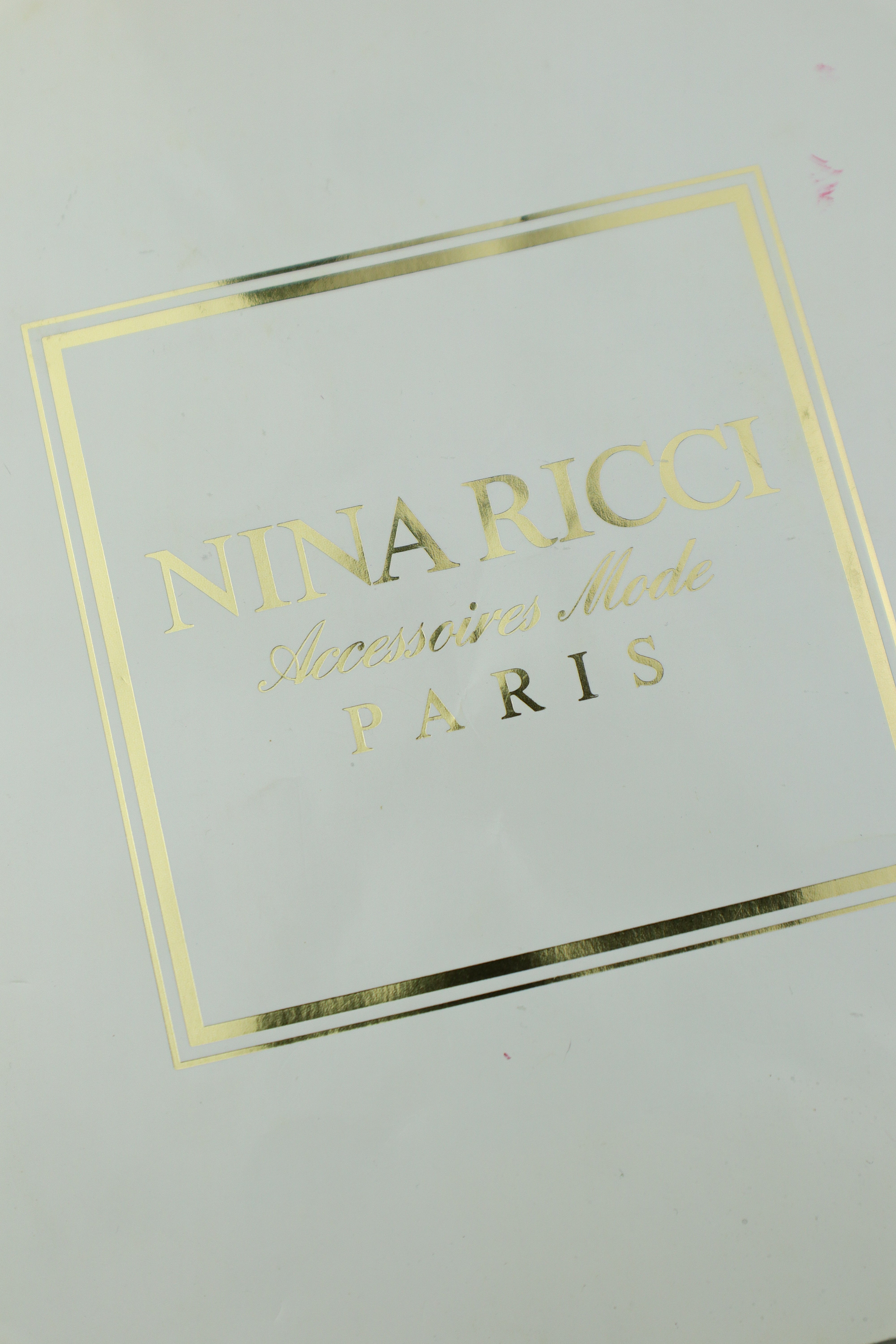 Nina Ricci - jedwabna apaszka w kokardy