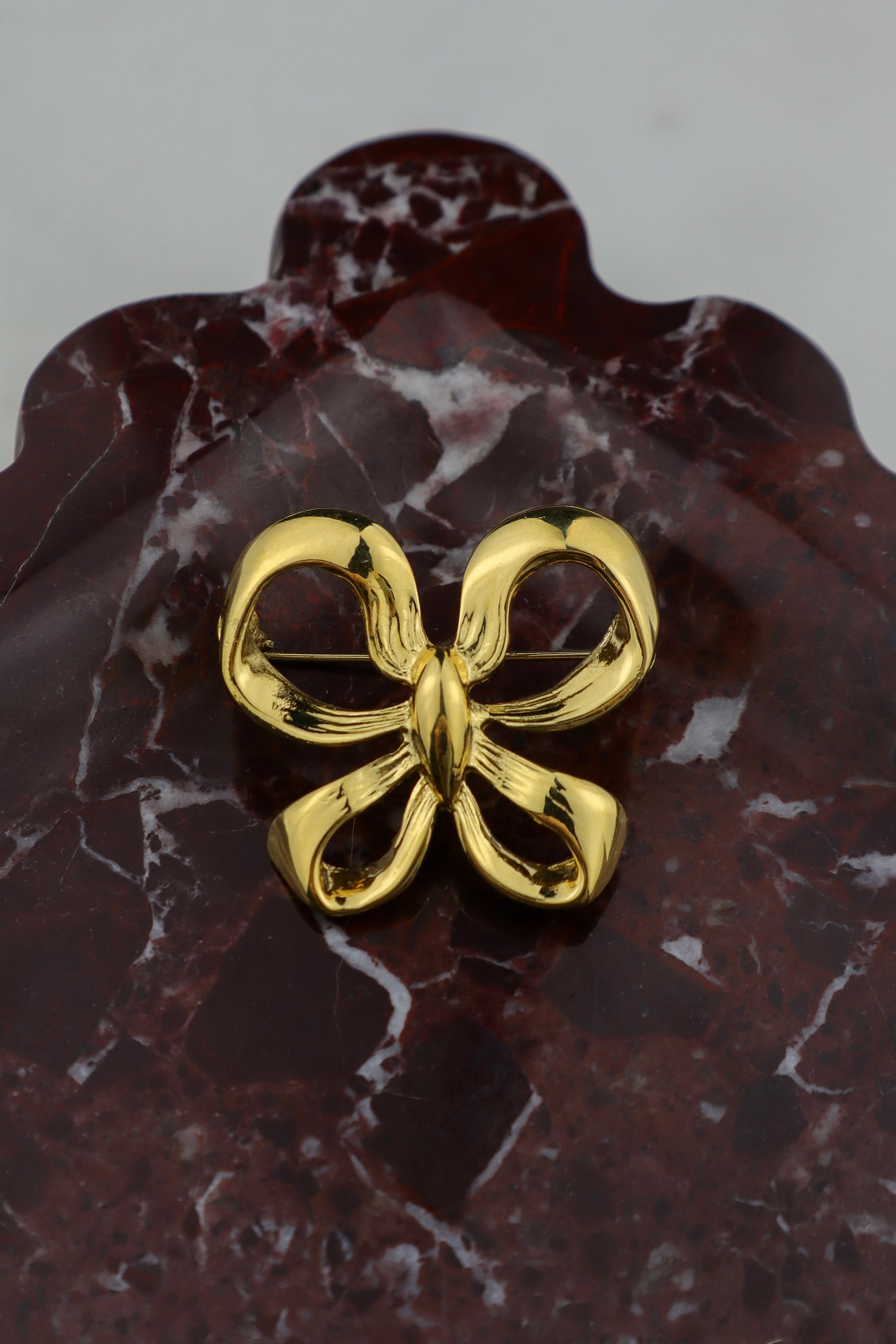 Yves Saint Laurent - broszka kokardka