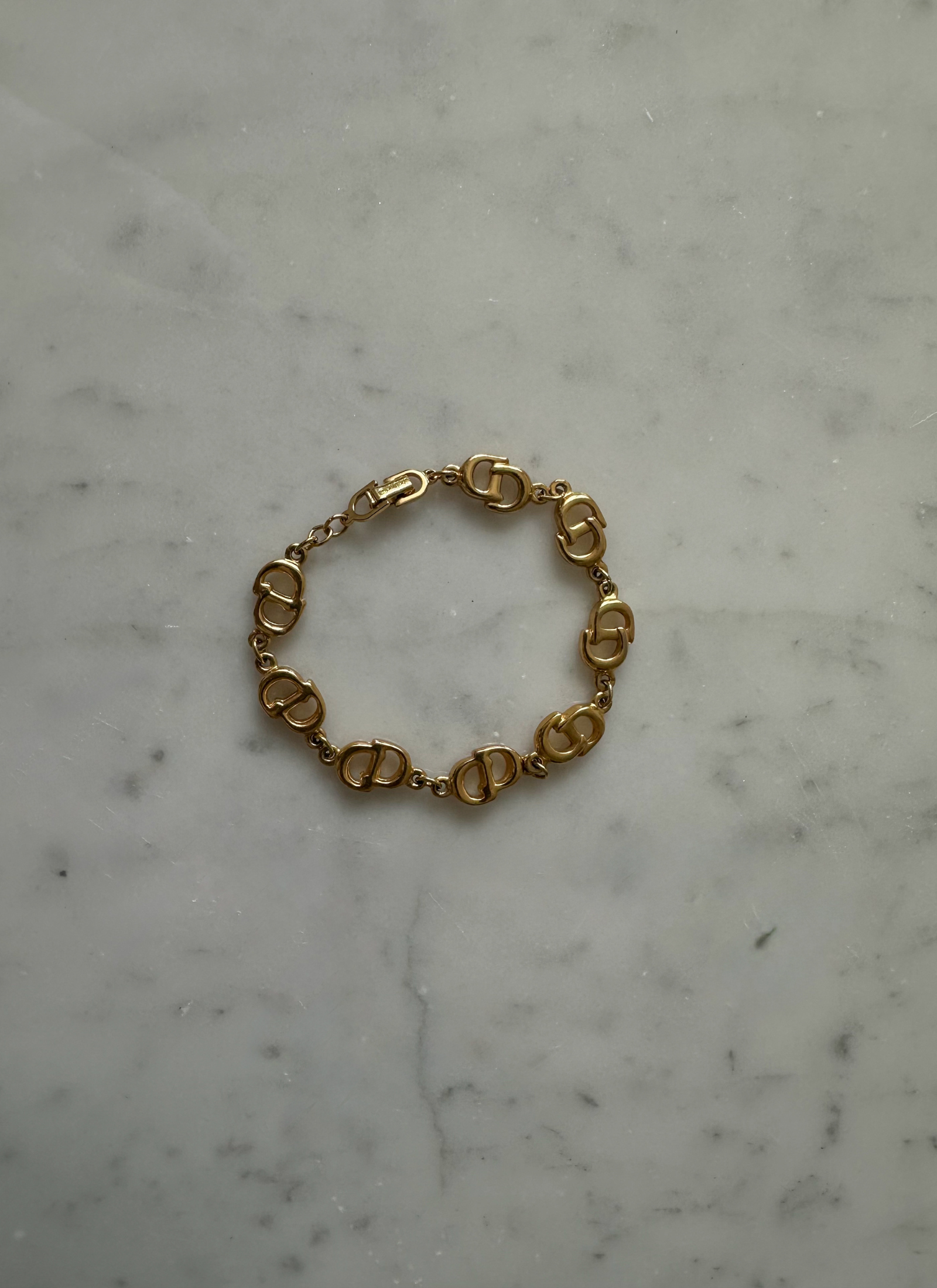 Christian Dior - pozłacana bransoletka "CD"